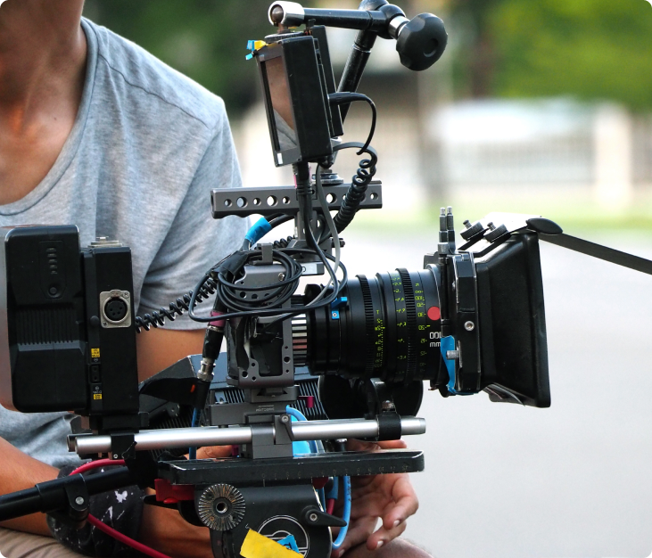 Videographer operating a professional cinema camera Videographer operating a professional cinema camera